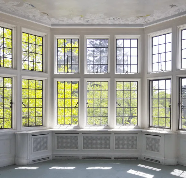 Large bay window with decorative ceiling molding.