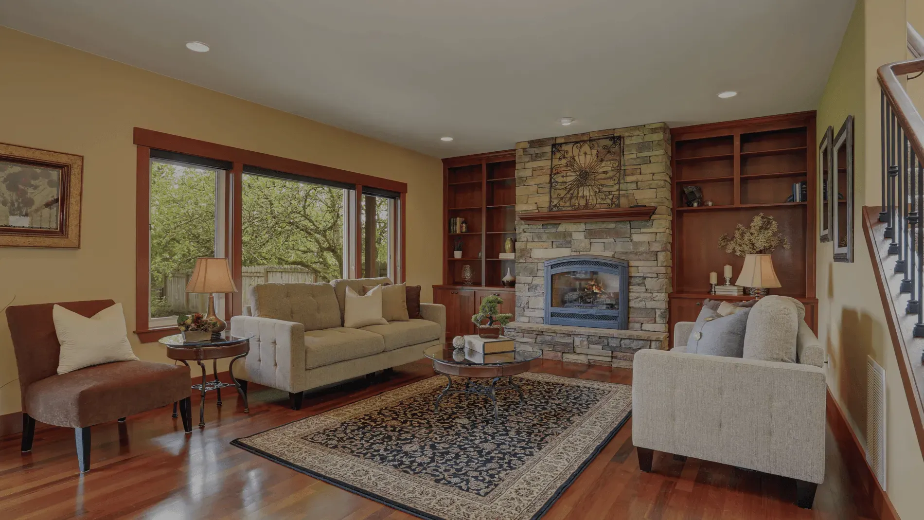 Cozy living room with stone fireplace.